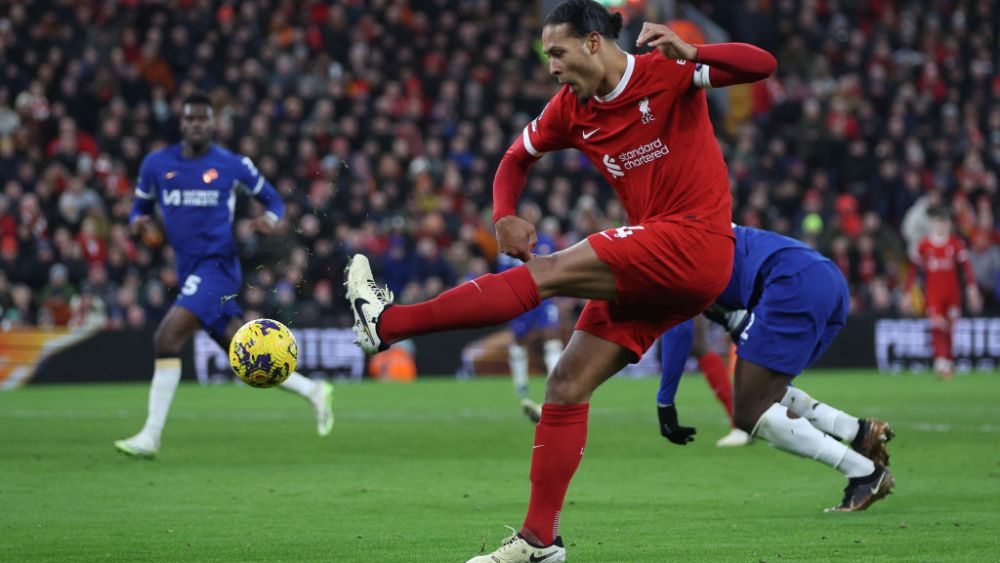 LIVERPOOL, ENGLAND - JANUARY 31:   Virgil van Dijk of Liverpool shoots at goal during the Premier League match between Liverpool FC and Chelsea FC at Anfield on January 31, 2024 in Liverpool, England. (Photo by Clive Brunskill/Getty Images)